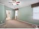 Inviting bedroom featuring neutral walls, carpet flooring, and natural light from the windows at 374 Queens Sw Dr, Concord, NC 28025