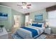Comfortable bedroom featuring soft carpet, ceiling fan, and decorative paintings for a serene feel at 374 Queens Sw Dr, Concord, NC 28025
