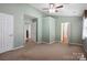 Spacious bedroom with neutral walls, carpeted floors, and natural light, offering a versatile space to personalize at 374 Queens Sw Dr, Concord, NC 28025