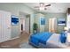 Spacious bedroom with plush carpet, ceiling fan, and bright natural light from the window at 374 Queens Sw Dr, Concord, NC 28025