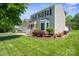Charming home with a well-manicured lawn and attractive landscaping with mature tree at 374 Queens Sw Dr, Concord, NC 28025