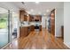 Spacious kitchen featuring wood cabinets, stainless steel appliances, and hardwood floors at 374 Queens Sw Dr, Concord, NC 28025