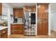Kitchen featuring stainless steel refrigerator and custom wood cabinetry at 374 Queens Sw Dr, Concord, NC 28025