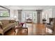 Bright living room featuring a bay window, hardwood floors, and neutral decor at 374 Queens Sw Dr, Concord, NC 28025