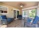 Relaxing sunroom with wood floors, lots of natural light, and comfortable seating. Great space to enjoy the outdoors from inside at 374 Queens Sw Dr, Concord, NC 28025