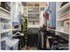 The well-organized walk-in closet is complete with custom shelves, rods, and storage containers at 374 Queens Sw Dr, Concord, NC 28025