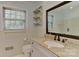 Bright bathroom featuring neutral walls, a granite-topped vanity, and large mirror at 385 Gum Branch Rd, Charlotte, NC 28214