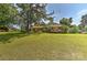 Traditional home with a large front yard and mature trees providing shade and curb appeal at 385 Gum Branch Rd, Charlotte, NC 28214