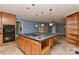 Spacious kitchen island with pendant lights, cabinets, and adjacent oven at 385 Gum Branch Rd, Charlotte, NC 28214