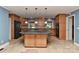 Bright kitchen featuring a center island, custom cabinetry, and stainless steel appliances at 385 Gum Branch Rd, Charlotte, NC 28214