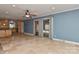 Bright living room with travertine floors and sliding glass doors leading to the backyard at 385 Gum Branch Rd, Charlotte, NC 28214