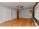 Main bedroom featuring hardwood floors, ceiling fan, closet, and attached bathroom at 385 Gum Branch Rd, Charlotte, NC 28214