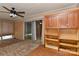 Bright sunroom featuring built-in storage cabinets, sliding glass doors, and tile flooring at 385 Gum Branch Rd, Charlotte, NC 28214