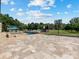 Backyard featuring a pool with lounge chairs, a basketball court, and an outdoor dining area at 4315 Hartis Grove Church Rd, Indian Trail, NC 28079