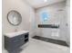 Modern bathroom featuring a floating vanity and a glass-enclosed shower at 4315 Hartis Grove Church Rd, Indian Trail, NC 28079