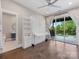 Bedroom with a Murphy bed, hardwood floors, and a sliding door to a balcony at 4315 Hartis Grove Church Rd, Indian Trail, NC 28079