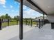 Enjoy this spacious outdoor deck with a beautiful view overlooking a sprawling backyard and mature trees at 4315 Hartis Grove Church Rd, Indian Trail, NC 28079