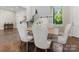 Dining room boasts a bright space and hardwood floors, with close proximity to the staircase at 4315 Hartis Grove Church Rd, Indian Trail, NC 28079