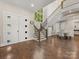 Bright, two story foyer with hardwood floors, staircase, and clerestory windows providing ample natural light at 4315 Hartis Grove Church Rd, Indian Trail, NC 28079