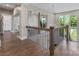 Hallway with hardwood floors, black metal railings, and a view to a bedroom at 4315 Hartis Grove Church Rd, Indian Trail, NC 28079