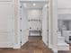 Inviting hallway with hardwood floors leads to a charming study nook at 4315 Hartis Grove Church Rd, Indian Trail, NC 28079