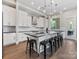 Bright kitchen with white cabinetry, stainless steel appliances, and black countertops at 4315 Hartis Grove Church Rd, Indian Trail, NC 28079