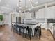 Kitchen features a large island with seating and modern stainless-steel appliances at 4315 Hartis Grove Church Rd, Indian Trail, NC 28079