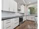 Bright kitchen with modern appliances, subway tile backsplash, and white cabinets at 4315 Hartis Grove Church Rd, Indian Trail, NC 28079