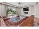 Living room with a fireplace, large sectional sofa, and sliding doors leading to a pool area at 4315 Hartis Grove Church Rd, Indian Trail, NC 28079