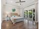Main bedroom with patio doors leading to deck with gym equipment at 4315 Hartis Grove Church Rd, Indian Trail, NC 28079