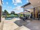 Relax on this outdoor patio with a dining table, swimming pool, and comfortable seating area at 4315 Hartis Grove Church Rd, Indian Trail, NC 28079