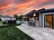 Beautiful backyard featuring a swimming pool, patio, bar with stools, and lush landscaping, perfect for outdoor living at 4315 Hartis Grove Church Rd, Indian Trail, NC 28079