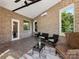 Enclosed sunroom with brick walls, tile flooring, and large windows providing ample natural light at 4315 Hartis Grove Church Rd, Indian Trail, NC 28079