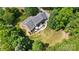 Aerial view showcasing a well-maintained backyard, patio, and lush landscaping at 4570 Chanel Ct, Concord, NC 28025
