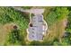 Overhead view of the home showing the roof, driveway, walkway, and mature trees at 4570 Chanel Ct, Concord, NC 28025