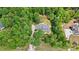 Aerial view of a beautiful home nestled in lush greenery with a circular driveway and well-manicured landscaping at 4570 Chanel Ct, Concord, NC 28025