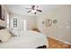 Comfortable bedroom with hardwood floors and a ceiling fan at 4570 Chanel Ct, Concord, NC 28025