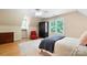 Bedroom featuring a workspace, comfortable bed, dresser and natural light at 4570 Chanel Ct, Concord, NC 28025