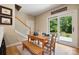 Bright dining area with staircase access and sliding doors leading to outdoor space at 4570 Chanel Ct, Concord, NC 28025