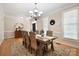 Bright dining room with hardwood floors, a large table, and stylish chandelier at 4570 Chanel Ct, Concord, NC 28025