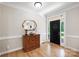Elegant foyer features hardwood floors, wainscoting, and a view of the front door at 4570 Chanel Ct, Concord, NC 28025