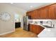 Modern kitchen with stainless steel appliances, white countertops, and warm wood cabinetry at 4570 Chanel Ct, Concord, NC 28025