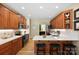 Bright kitchen with stainless steel appliances, white countertops, wood floors and custom cabinets at 4570 Chanel Ct, Concord, NC 28025