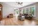 Bright living room featuring hardwood floors, a large window, and comfortable seating at 4570 Chanel Ct, Concord, NC 28025