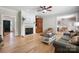 Cozy living room with fireplace, hardwood floors, and an open floor plan at 4570 Chanel Ct, Concord, NC 28025
