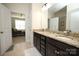 Bathroom boasts granite countertops, double sinks and leads to a shower and bedroom at 5063 Gribble Ln, Lancaster, SC 29720