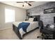 Bedroom features a brick accent wall, a bed with a blue comforter, and a desk at 5063 Gribble Ln, Lancaster, SC 29720