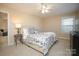 Bedroom featuring a ceiling fan, large window, and neutral wall colors at 5063 Gribble Ln, Lancaster, SC 29720
