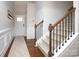Inviting foyer showcasing hardwood floors, stairs with wood and iron railing and natural light at 5063 Gribble Ln, Lancaster, SC 29720