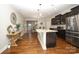 Spacious kitchen featuring granite countertops and stainless steel appliances with hardwood floors at 5063 Gribble Ln, Lancaster, SC 29720